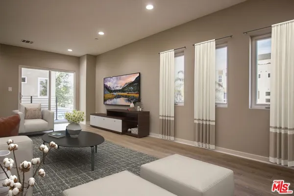 a living room with furniture and a gate