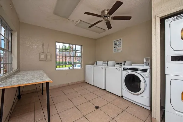 a view of a hallway with washer and dryer