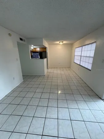 a view of an empty room and window