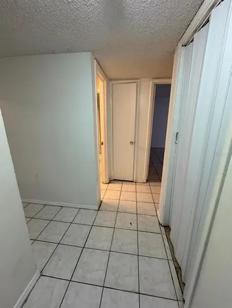 a view of empty room with windows