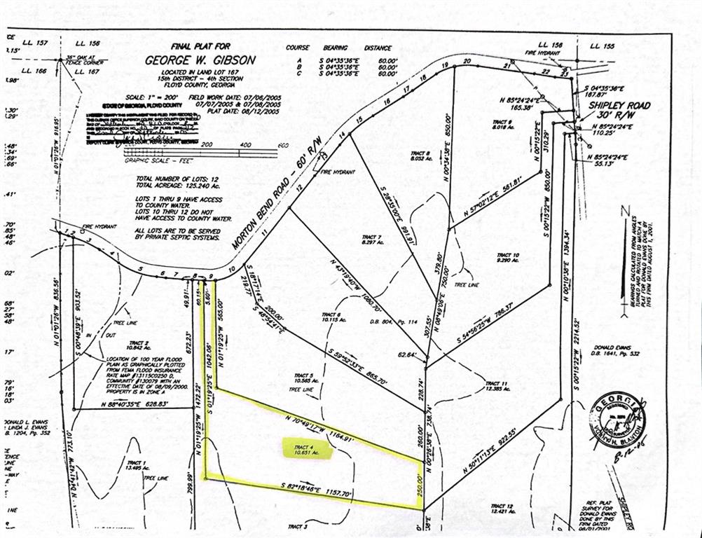 a picture of a bathroom with a shower and a picture on the wall