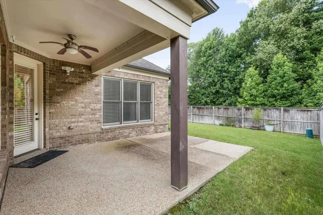 a view of a porch in front of house