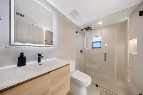 a bedroom with a bed and furniture