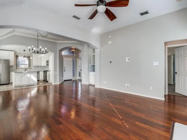 a view of a living room and kitchen view