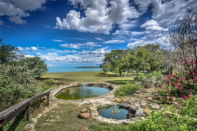 a view of a swimming pool with a yard