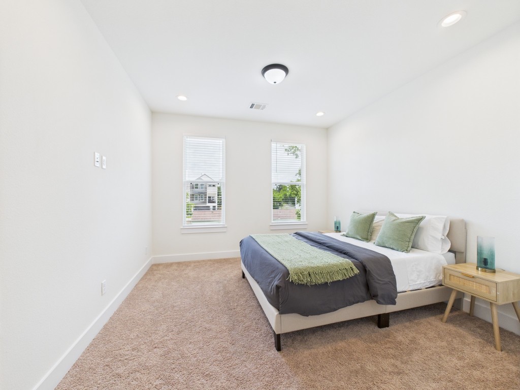 4306 Idaho Street Houston, TX 77021 - Photo 25 of 30 a spacious bedroom with a bed and a window