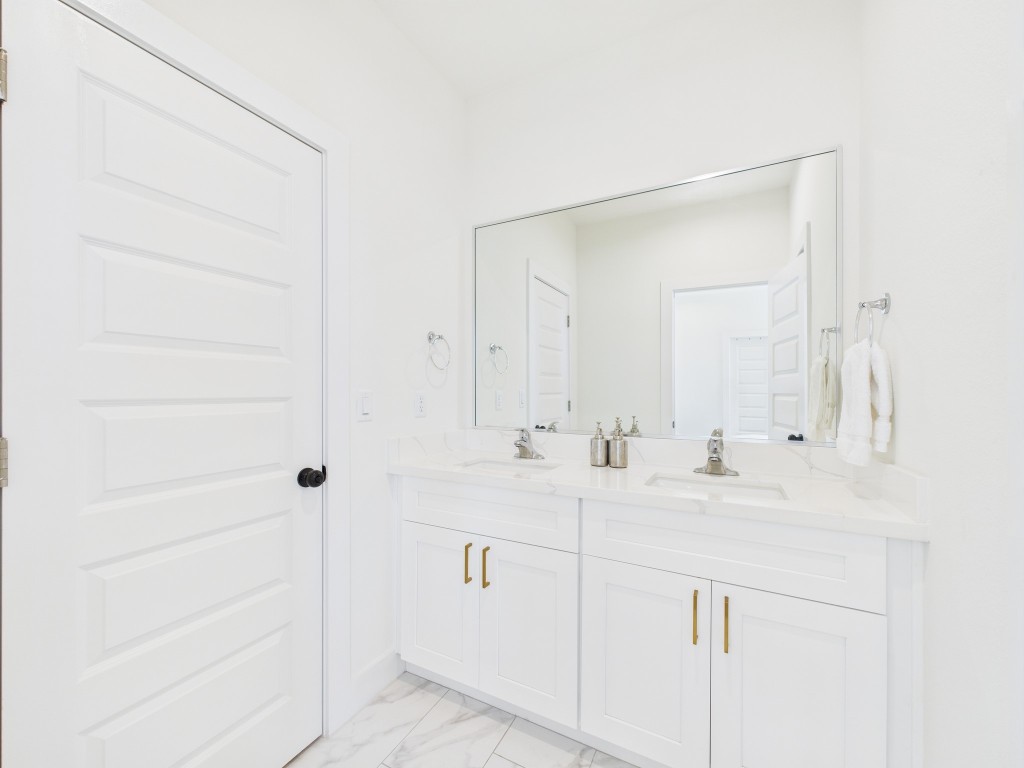 4306 Idaho Street Houston, TX 77021 - Photo 26 of 30 a bathroom with a sink and a mirror