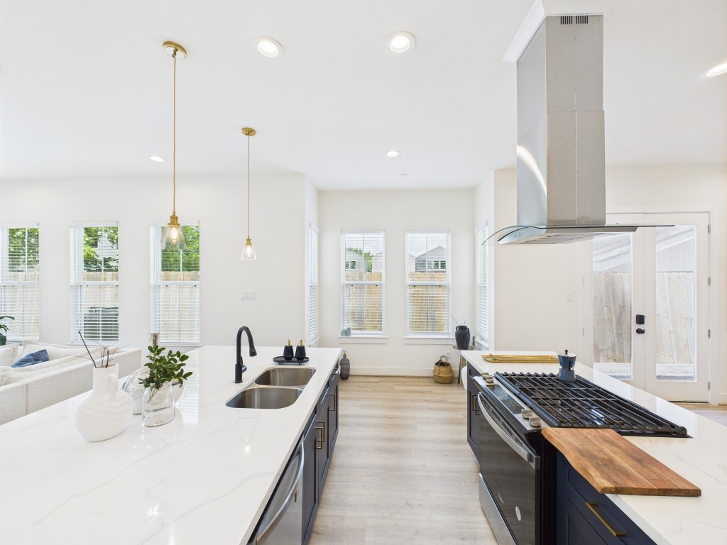 4306 Idaho Street Houston, TX 77021 - Photo 10 of 30 a large kitchen with stainless steel appliances a large counter top a stove and a sink