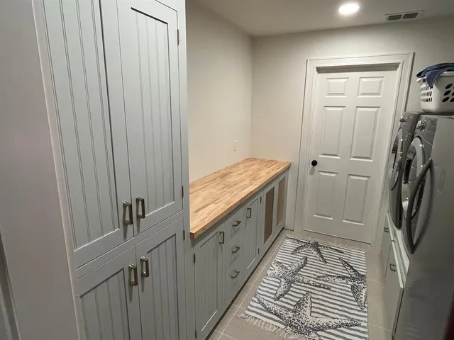 a kitchen with a cabinets and window