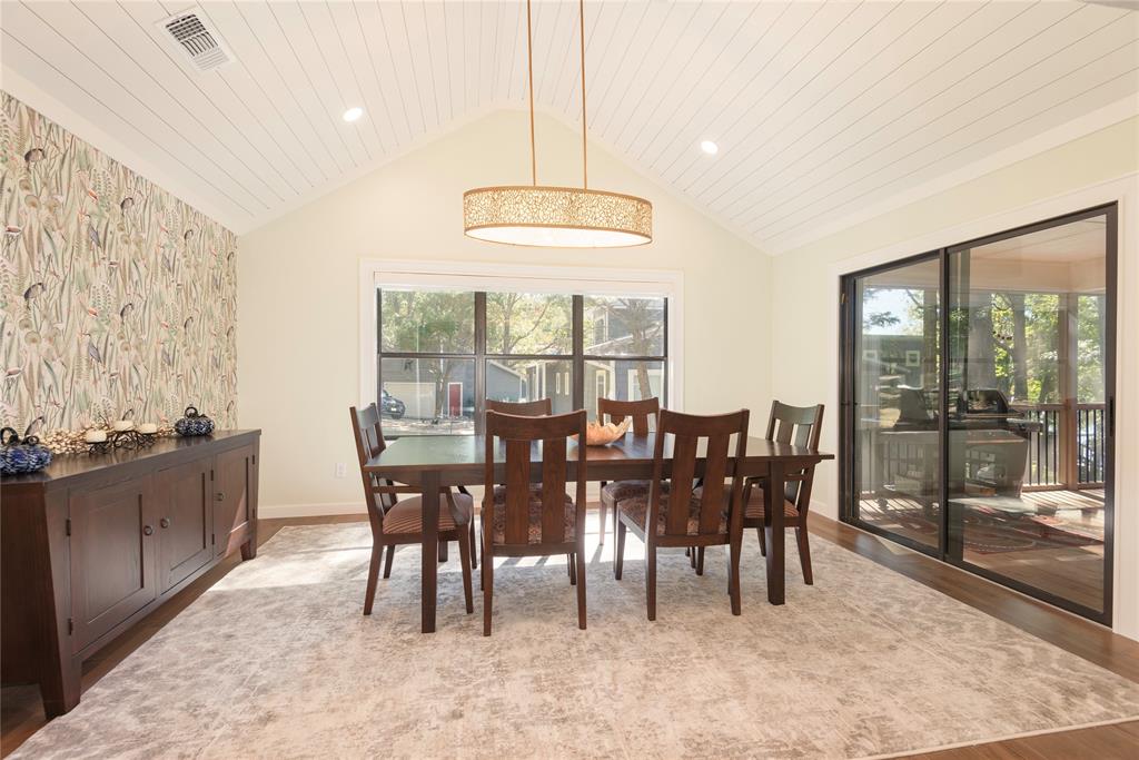 560 Private Road Edna, TX 77957 - Photo 22 of 40 Separate dining area opens to the screened porch.