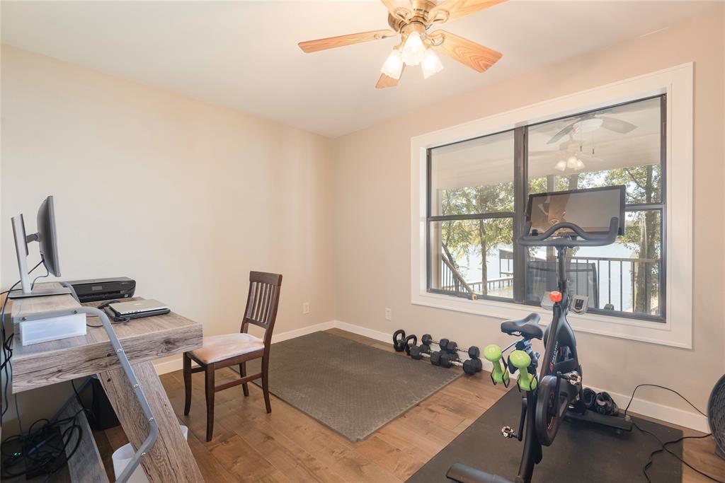 560 Private Road Edna, TX 77957 - Photo 29 of 40 4th bedroom currently used as an office / workout room with a beautiful lake view!