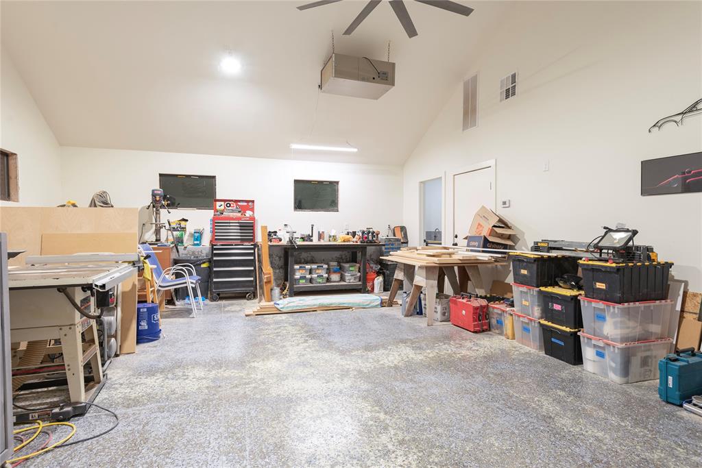 560 Private Road Edna, TX 77957 - Photo 33 of 40 Oversized 3 car garage with workshop is climate controlled!