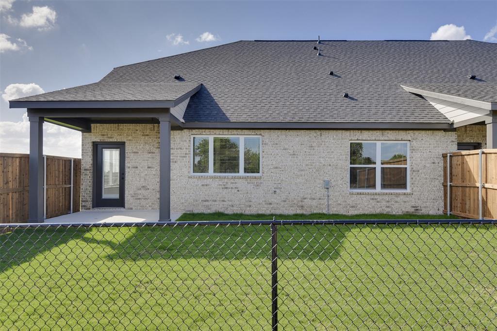 4042 Clovis Street Midlothian, TX 76065 - Photo 21 of 22 a front view of a house with a yard and garage