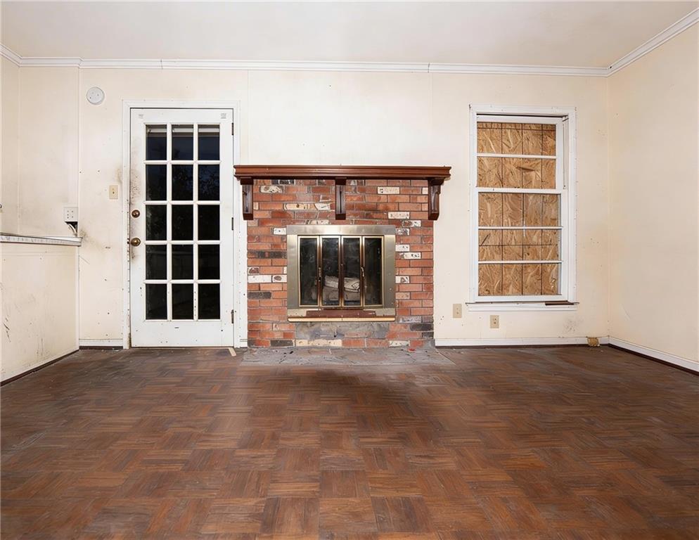 5195 Austell Road Austell, GA 30106 - Photo 12 of 34 an empty room with a fireplace and window