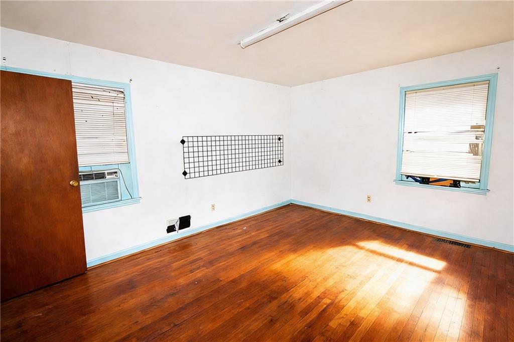 5195 Austell Road Austell, GA 30106 - Photo 22 of 34 a view of empty room with wooden floor and fan