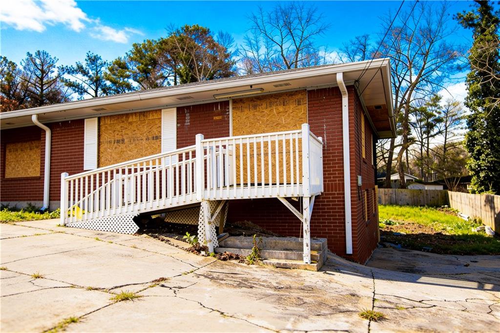 5195 Austell Road Austell, GA 30106 - Photo 4 of 34 a view of a wooden house with a yard