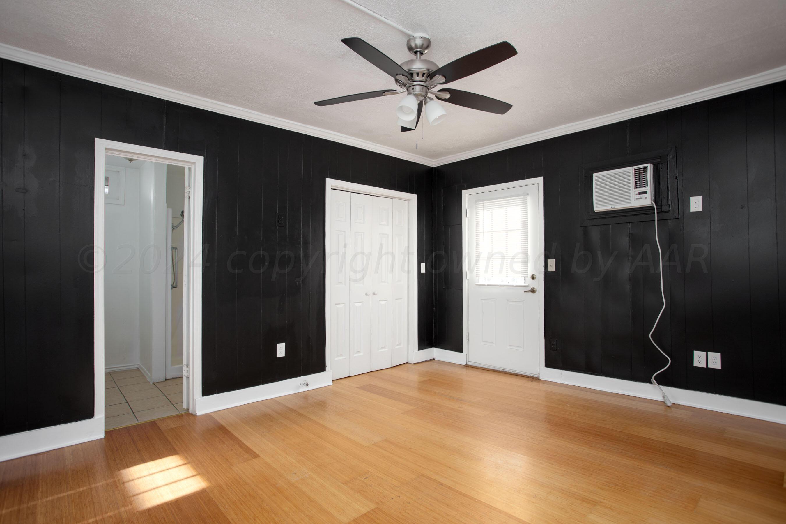 5318 Albert Avenue Amarillo, TX 79106 - Photo 17 of 24 a view of a livingroom with a ceiling fan and window