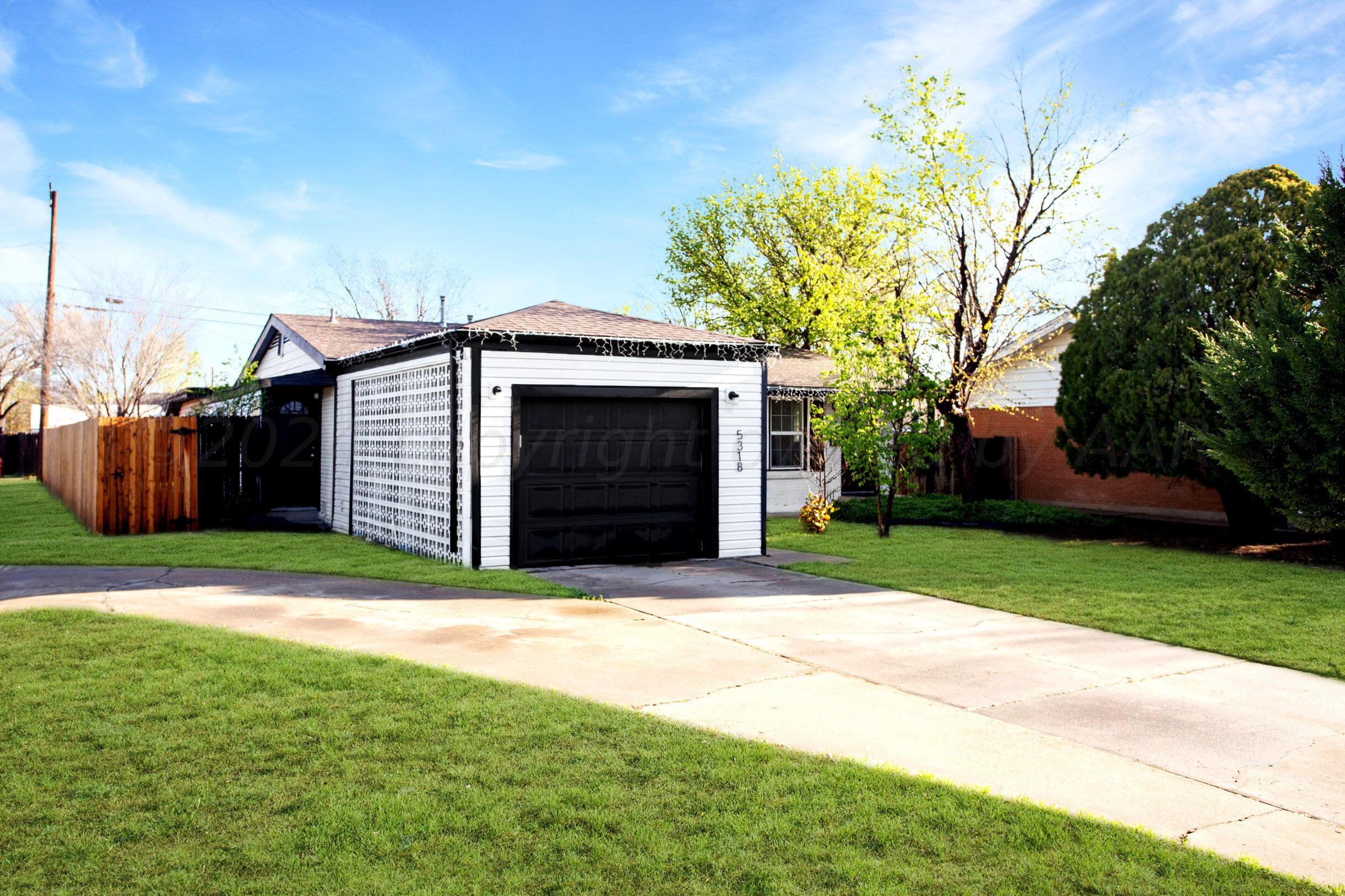5318 Albert Avenue Amarillo, TX 79106 - Photo 2 of 24 a front view of a house with garden