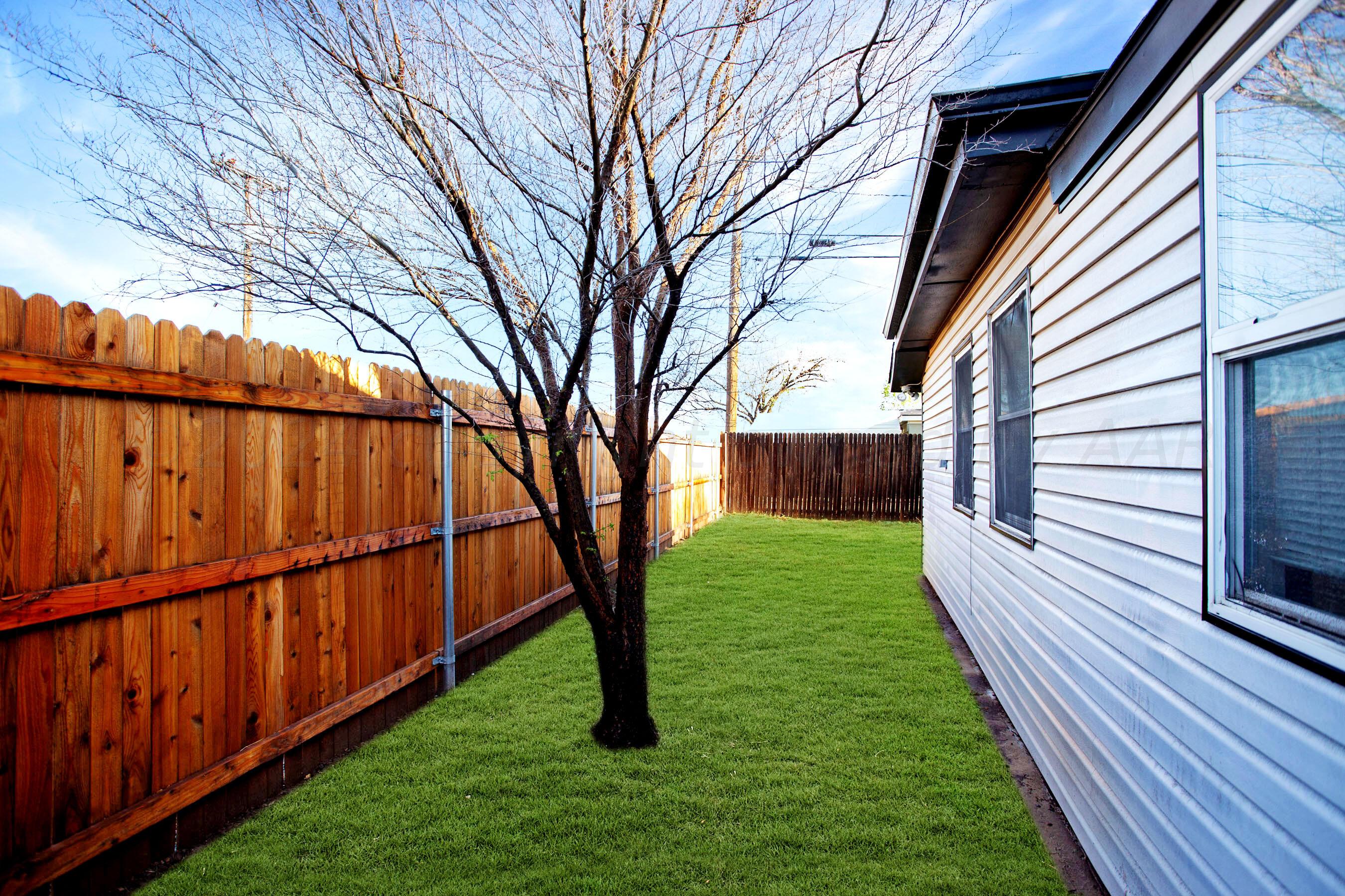 5318 Albert Avenue Amarillo, TX 79106 - Photo 22 of 24 a view of a backyard with wooden fence