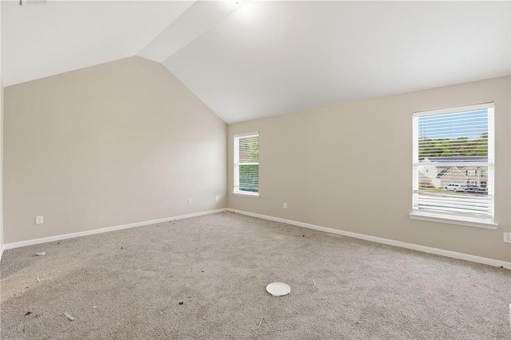 4968 Locherby Drive Fairburn, GA 30213 - Photo 22 of 39 an empty room with windows