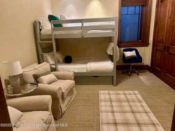 a living room with a couch and a rug