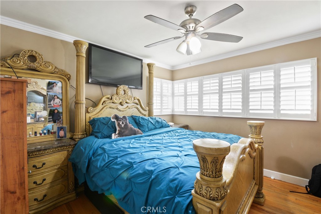 627 West Front Street Covina, CA 91722 - Photo 11 of 16 a bedroom with a bed and a large window