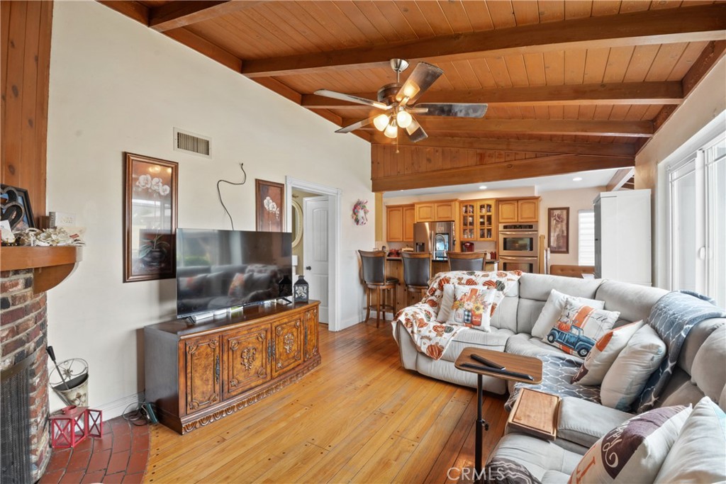 627 West Front Street Covina, CA 91722 - Photo 2 of 16 a living room with furniture and a flat screen tv