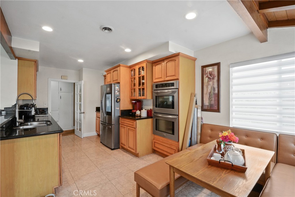 627 West Front Street Covina, CA 91722 - Photo 3 of 16 a kitchen with stainless steel appliances a refrigerator and a stove