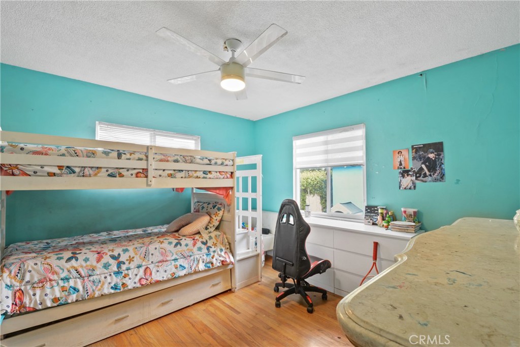 627 West Front Street Covina, CA 91722 - Photo 8 of 16 a bed room with furniture and a clock