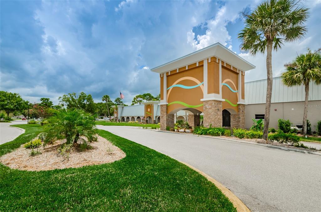 11427 Turtle Dove Place New Port Richey, FL 34654 - Photo 61 of 100 a front view of a house with a yard and potted plants