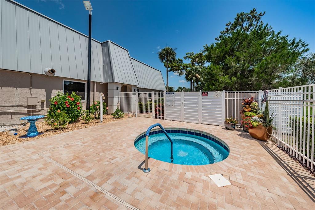 11427 Turtle Dove Place New Port Richey, FL 34654 - Photo 67 of 100 a view of a house with backyard and sitting area