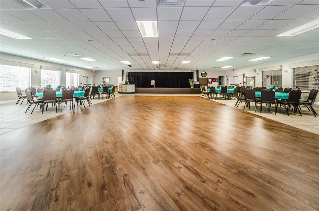 11427 Turtle Dove Place New Port Richey, FL 34654 - Photo 88 of 100 a view of a room with lots of furniture and wooden floor