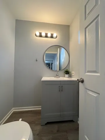 a bathroom with a sink and mirror