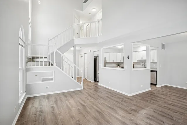 a view of a kitchen cabinets and wooden floor