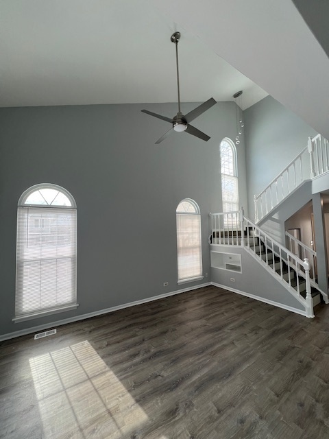 267 Cobblestone Court, Unit 267 Schaumburg, IL 60173 - Photo 5 of 19 a view of an empty room with window and chandelier fan