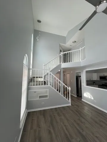 a view of an entryway with wooden floor