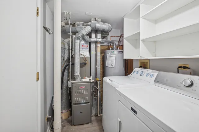 a view of a storage & utility room with washer and dryer