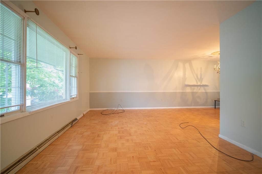 565 Jefferson Street Rochester, PA 15074 - Photo 3 of 12 a view of empty room with wooden floor and fan