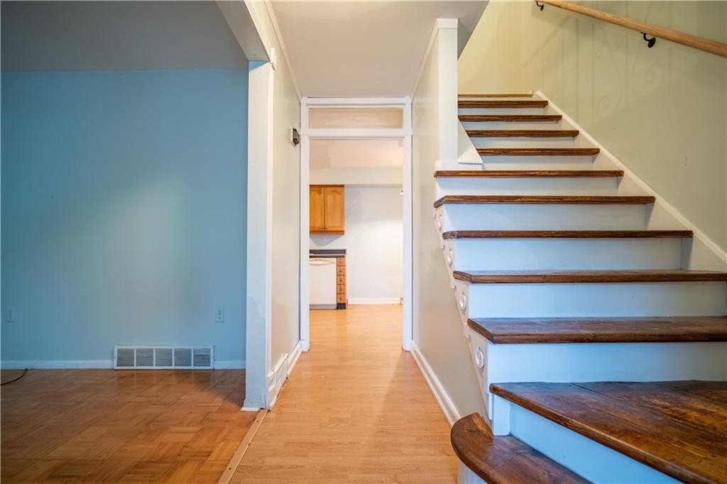 565 Jefferson Street Rochester, PA 15074 - Photo 5 of 12 a view of a hallway with wooden floor and entryway