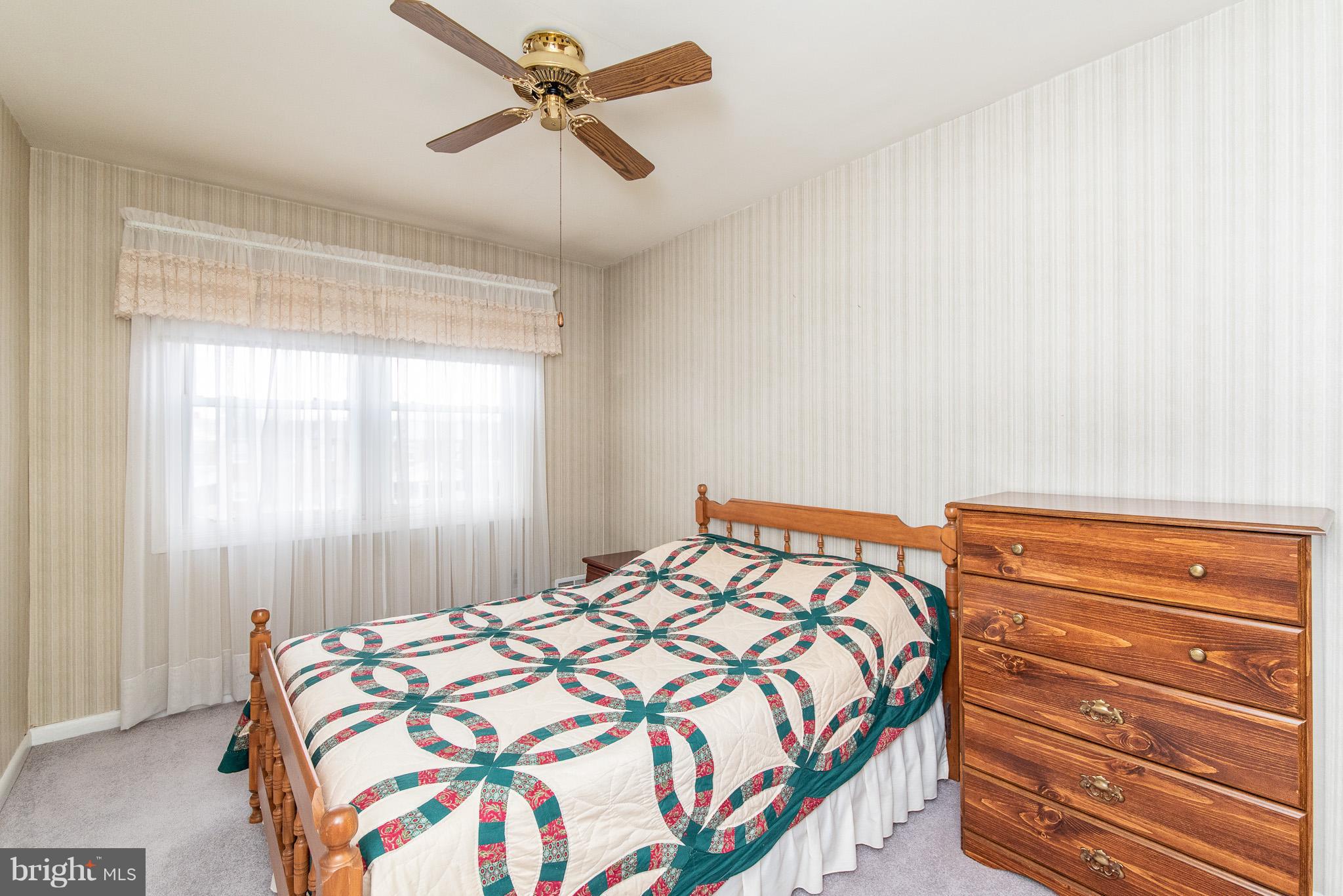 1621 Lynch Road Baltimore, MD 21222 - Photo 22 of 45 a bedroom with a bed and a window