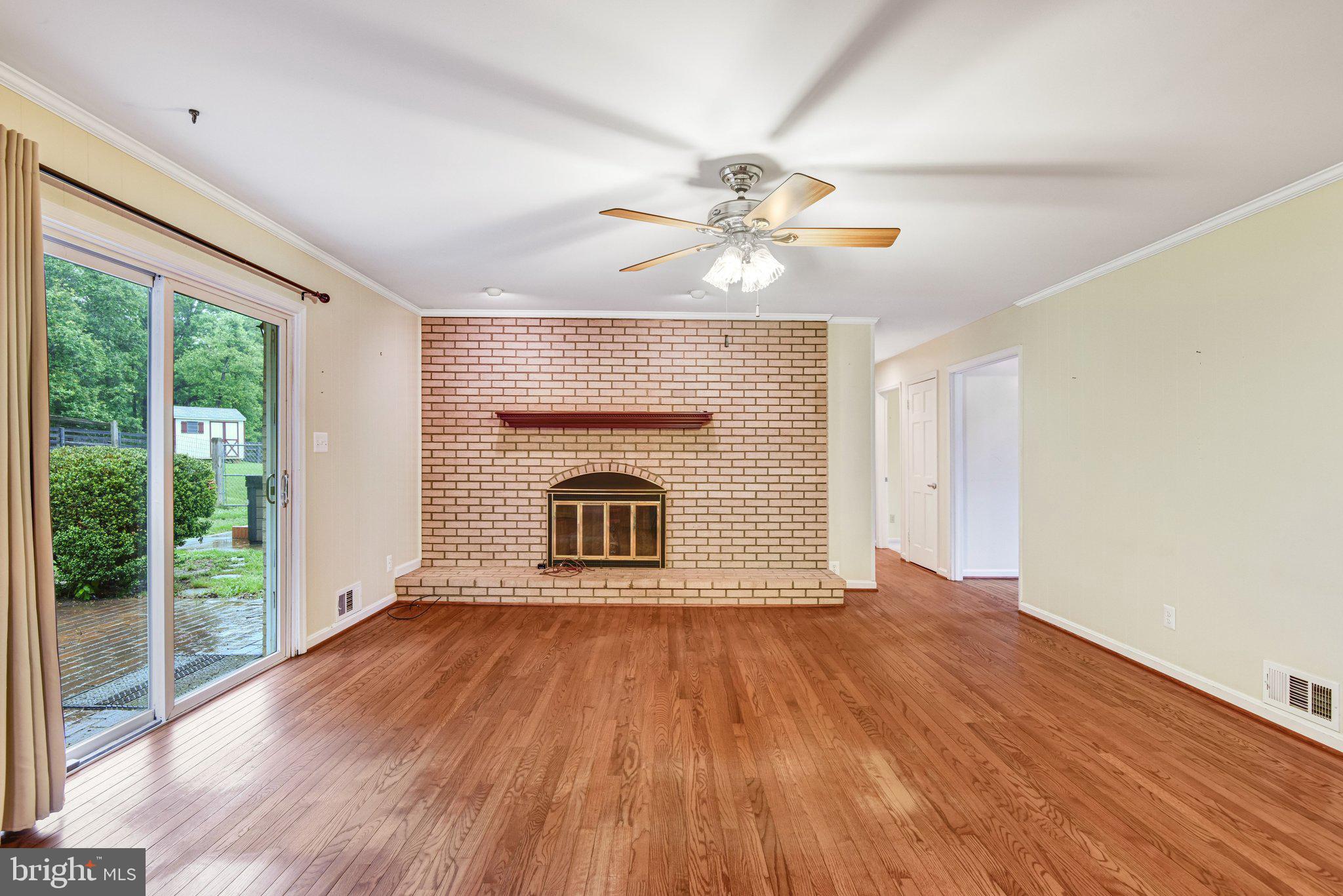 7961 Leeds Manor Road Marshall, VA 20115 - Photo 11 of 40 a view of empty room with wooden floor and fan