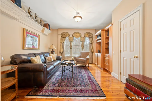 a living room with furniture rug and window