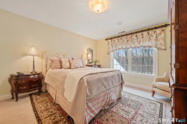 a spacious bathroom with a double vanity sink mirror and shower
