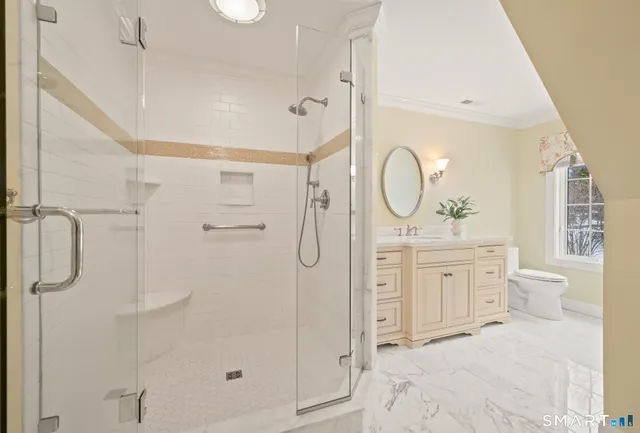 a bed room with a bed and a chair