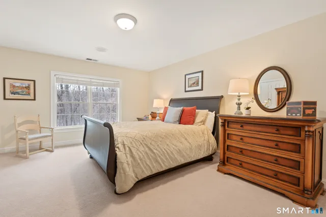 a bathroom with a sink a mirror and a vanity