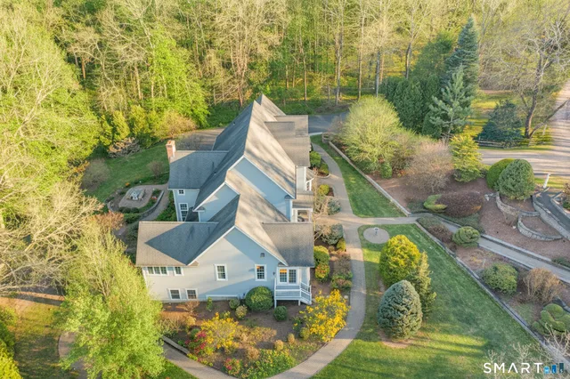 an aerial view of residential houses with outdoor space