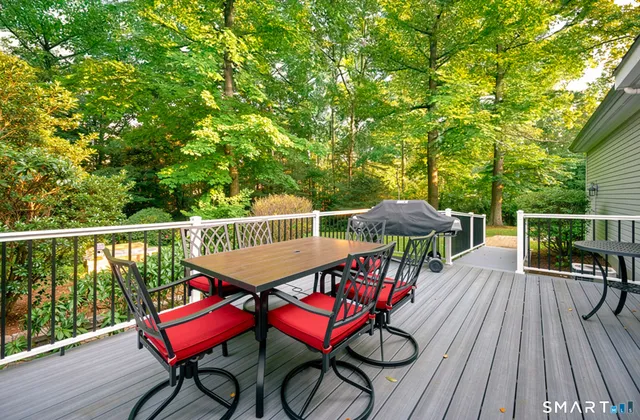 a view of a field of grass and trees