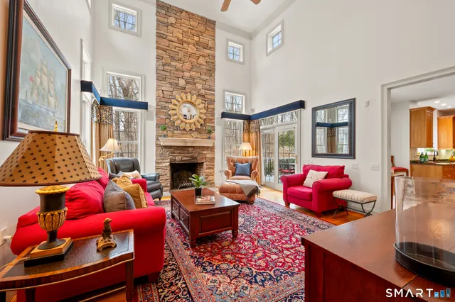 a living room with furniture rug and window