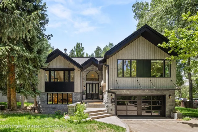 a front view of a house with garage