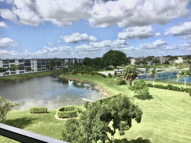 4014 Newcastle A Boca Raton, FL 33434 - Photo 11 of 33 a view of a lake with houses in the back